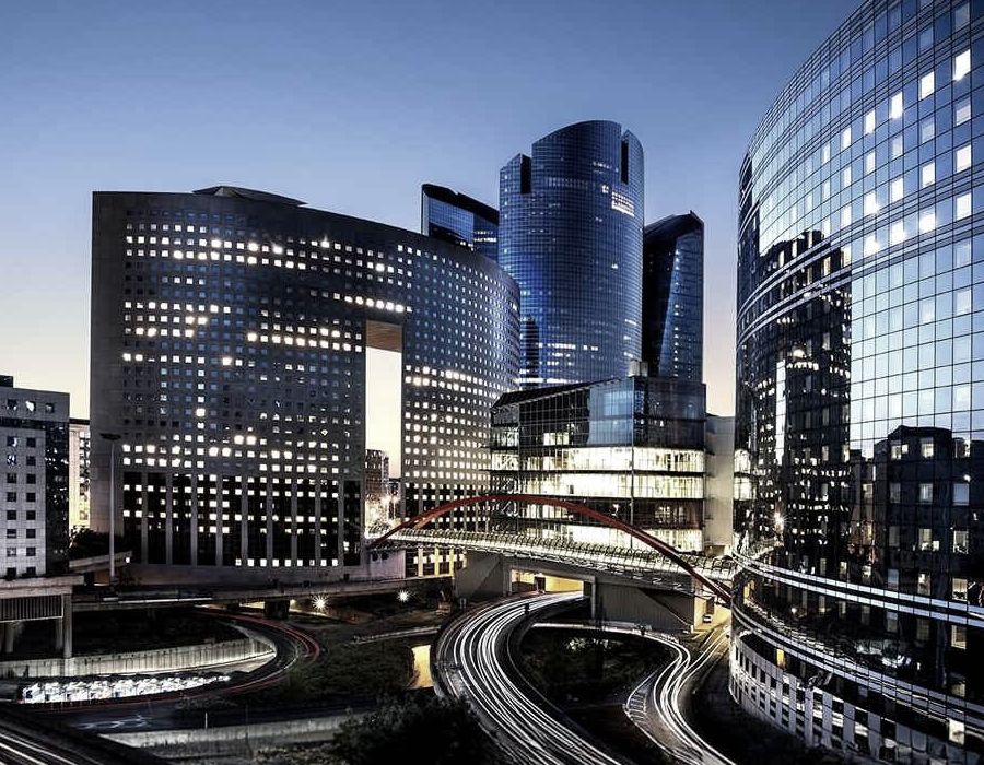 Modern office buildings representing Tax Village India's corporate clients