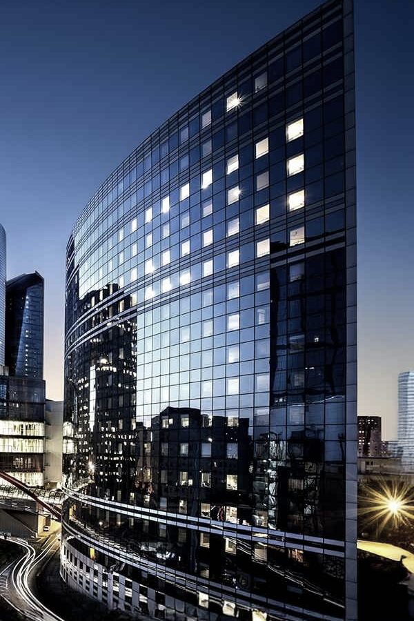 Modern glass office towers at dusk